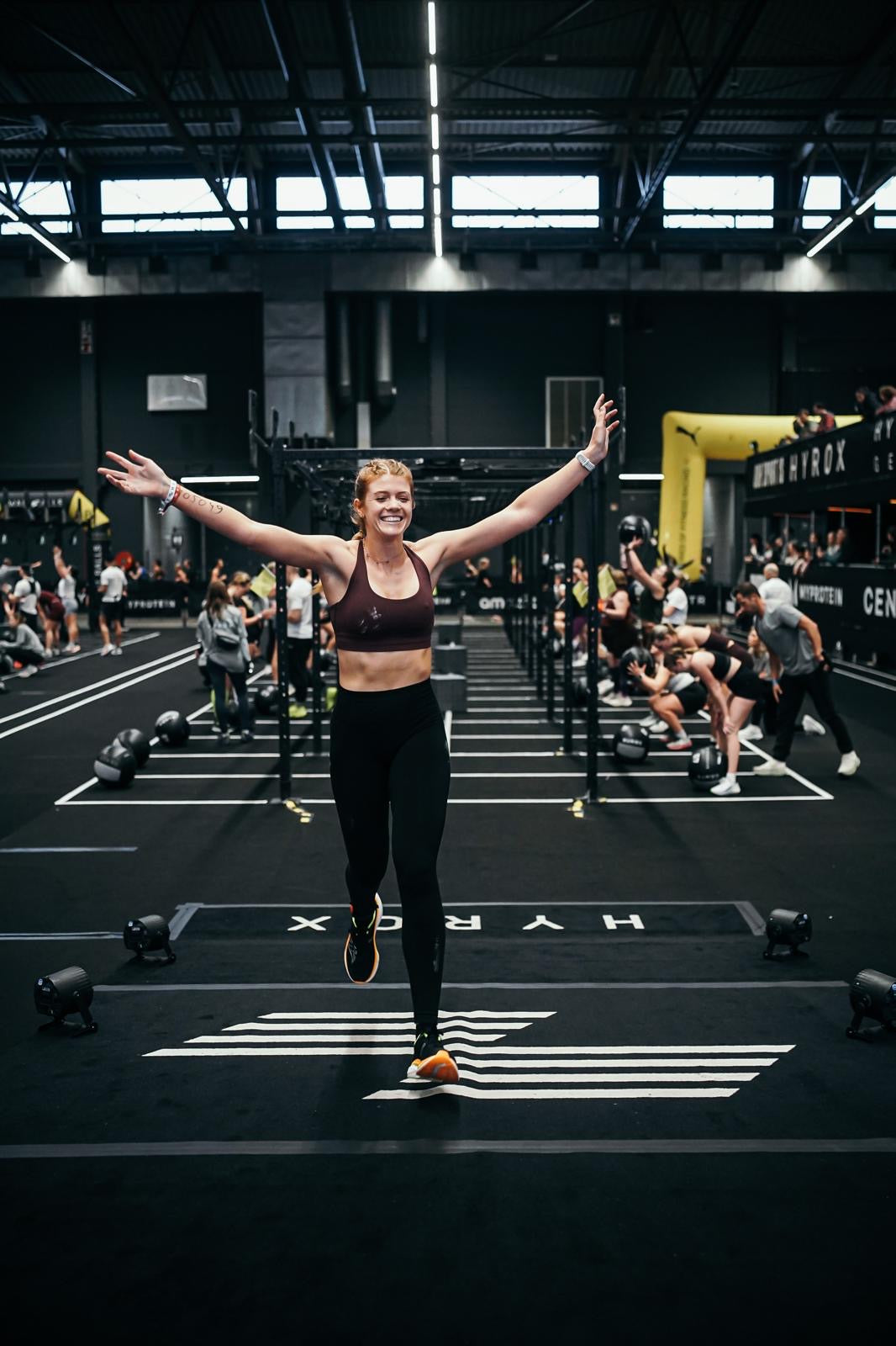 HYROX finish line — athlete crossing